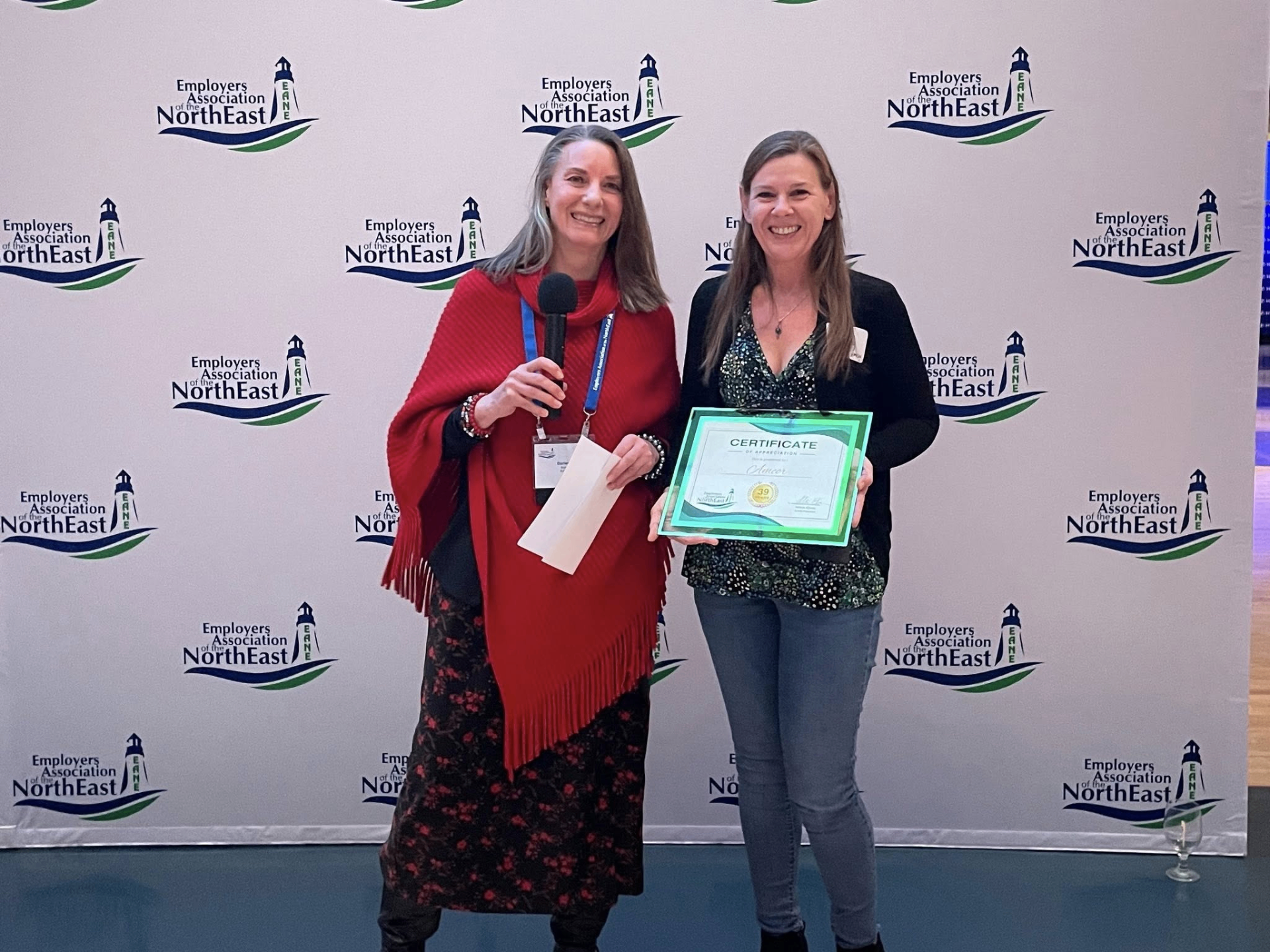 EANE member receiving certificate